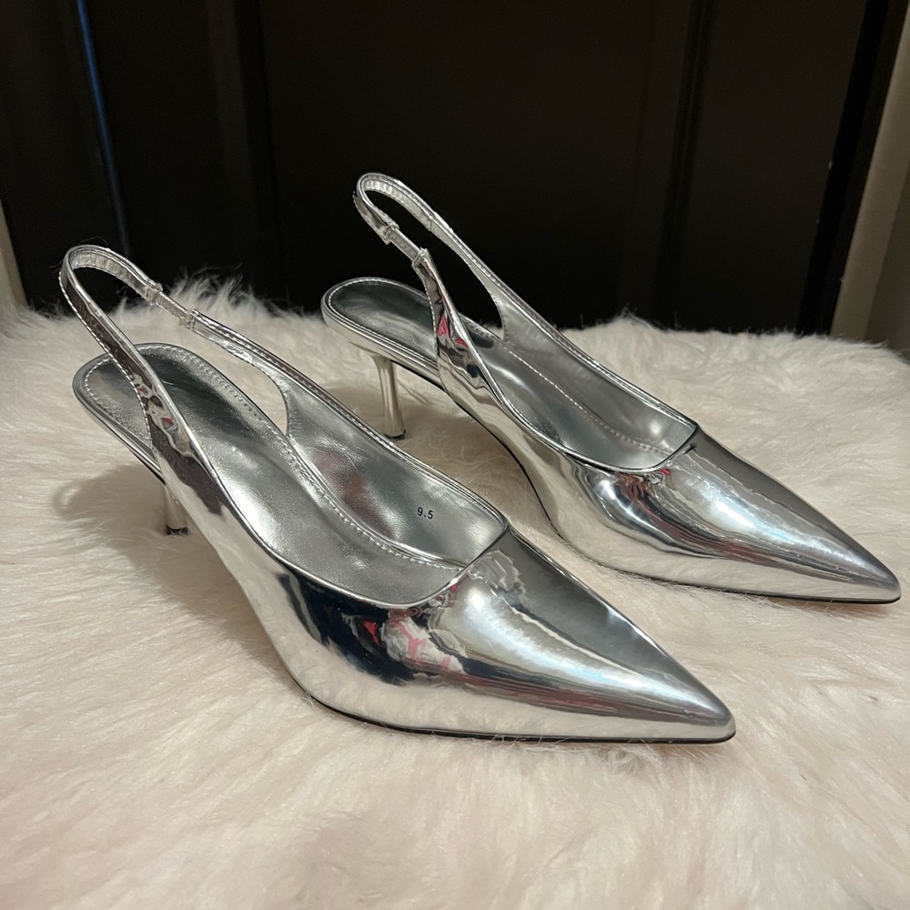 Silver metallic kitten heels.